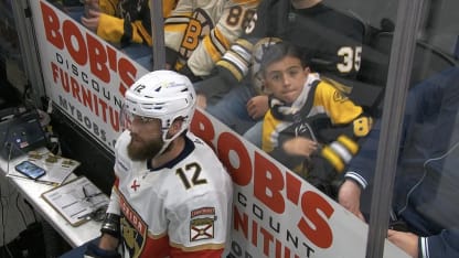 Bruins fan dances behind Panthers player